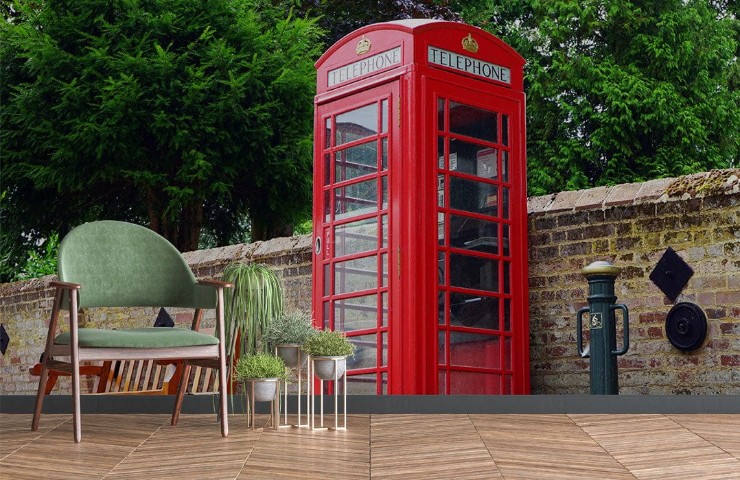 Classic Red British Telephone Box Mural Wallpaper with vintage green chair, wooden flooring, outdoor setting.