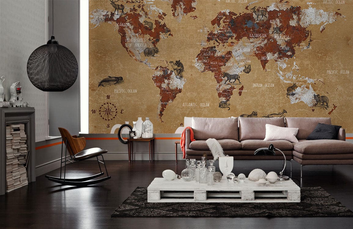 Vintage Earth Tones World Map Mural Wallpaper with Animal Illustrations in living room, dark wood flooring.