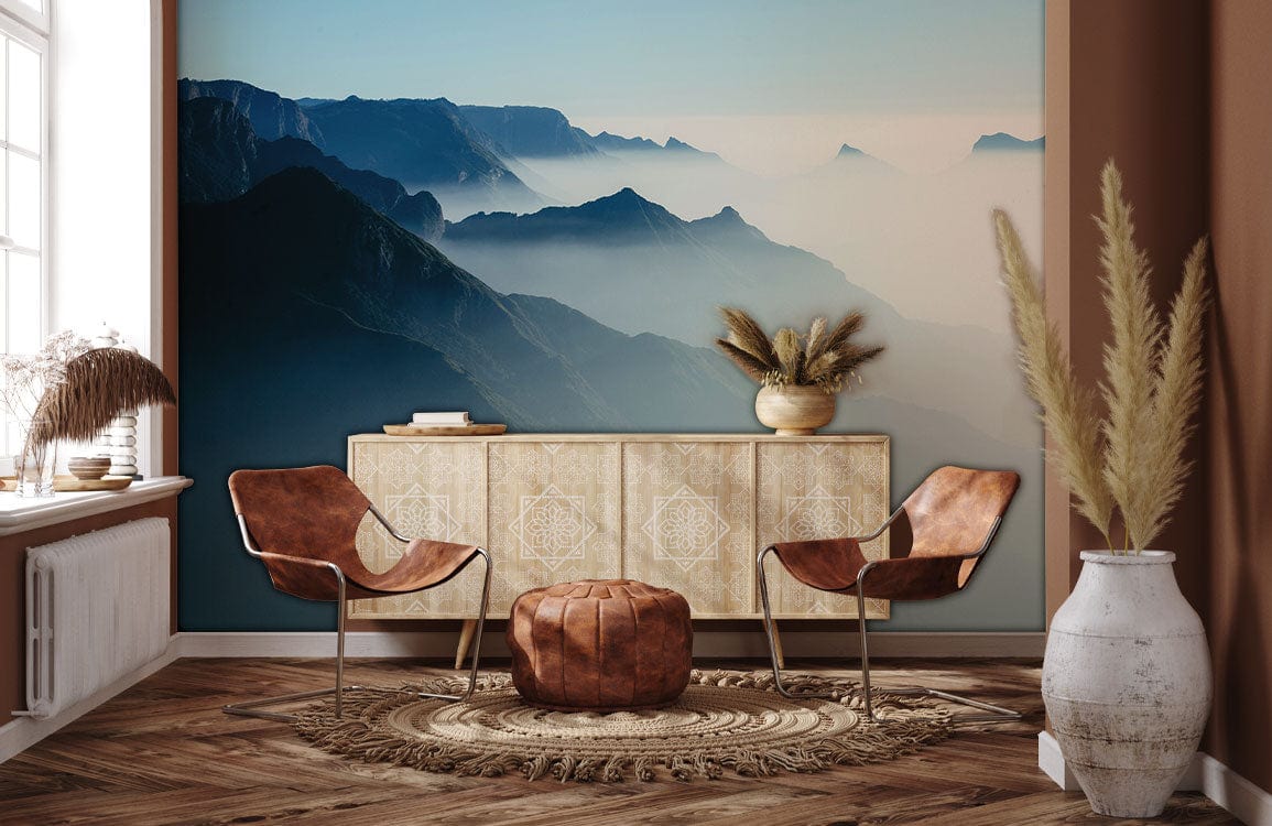 Tranquil blue mountain mural wallpaper in living room with rustic chairs, wooden flooring, and neutral decor.