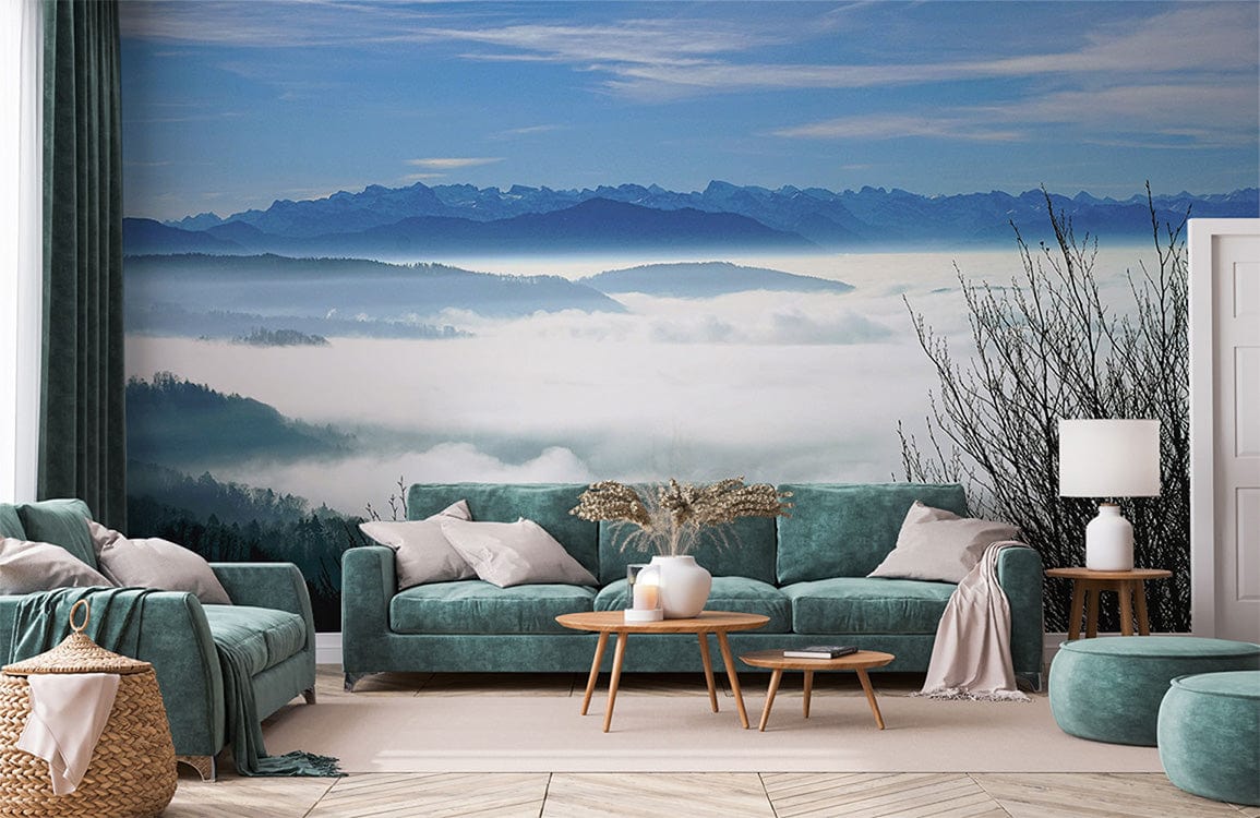 Elegant living room with Serene Mountain Mural, teal sofas, wood tables, and light geometric flooring.