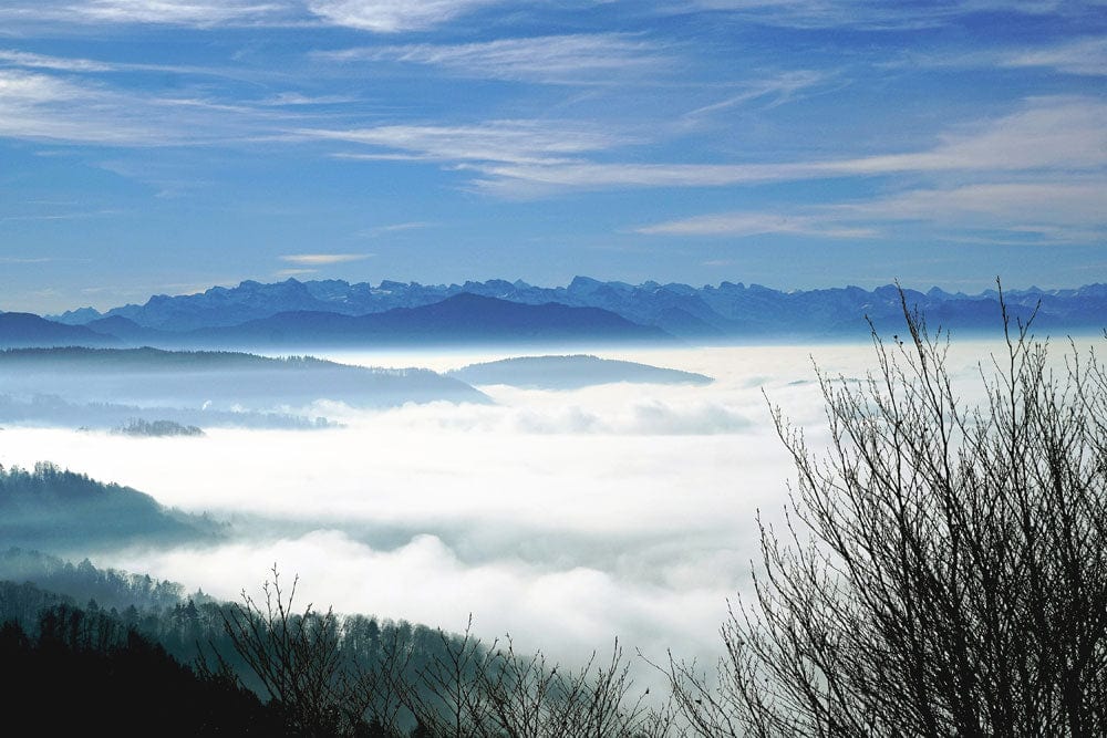 Serene Mountain Mist Landscape Mural Wallpaper in Calming Blue and White
