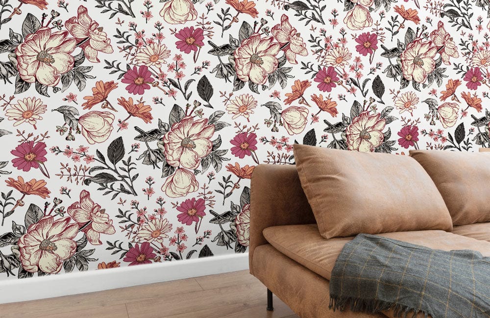 Vintage floral wallpaper with pink blossoms, brown sofa, wooden flooring, and stylish wall design.