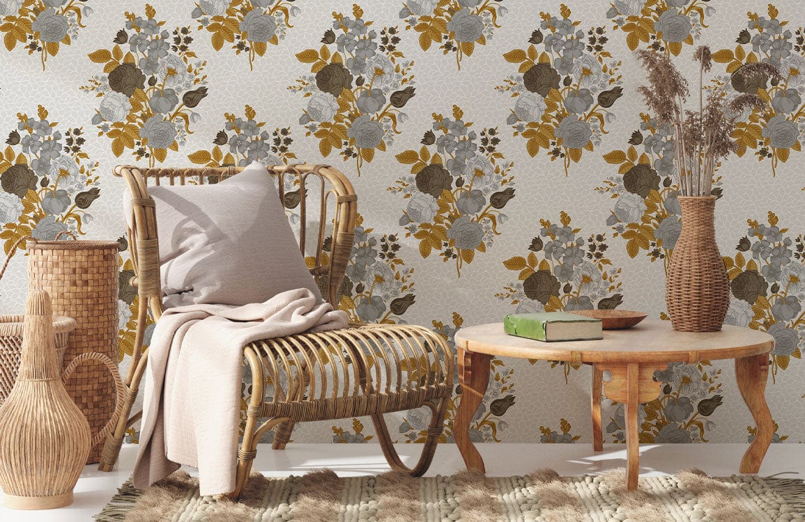 Vintage floral wallpaper in grey and mustard with rattan furniture in cosy living room setting.