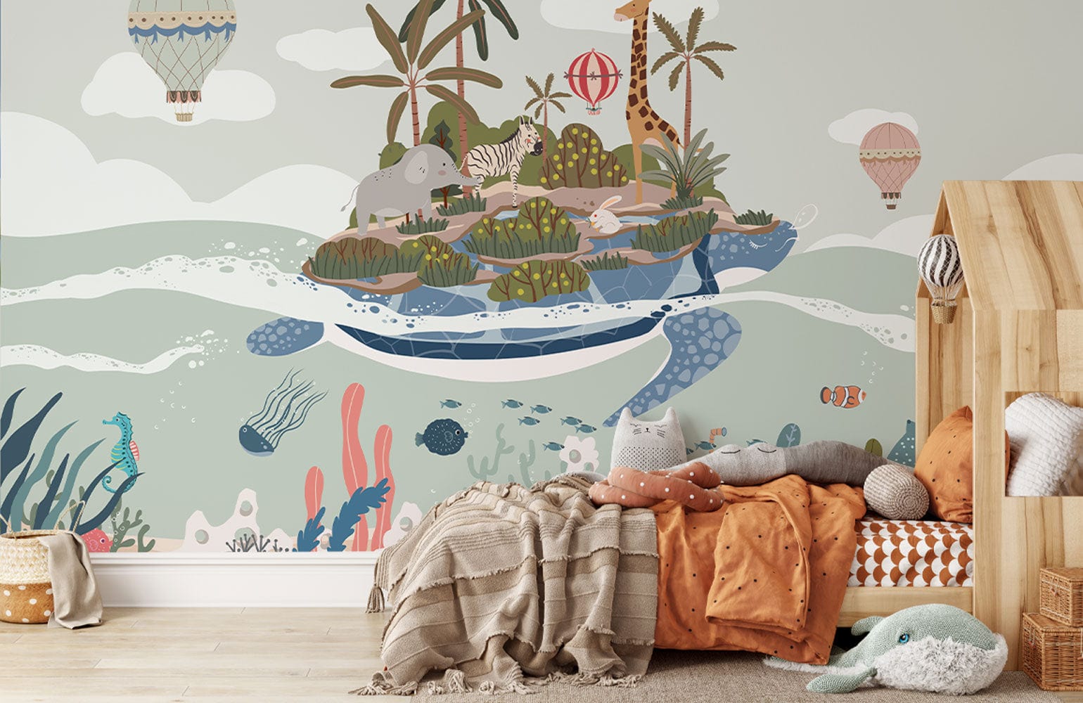 Children's room with nautical wallpaper mural, pastel colours, wooden bed, plush toys, and cosy bedding.