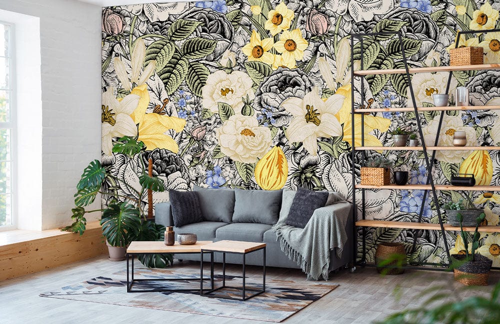 Vintage floral wallpaper with yellow, blue flowers; modern grey sofa, wooden shelf, bright living room.