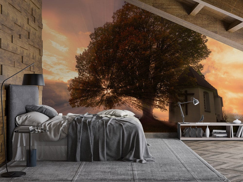 Tranquil sunset mural in bedroom with grey bed, wooden wall, and chevron flooring - autumn glow design.
