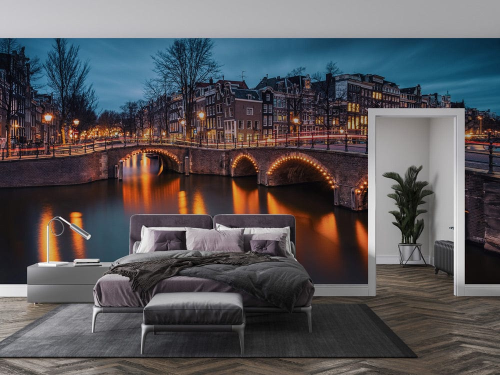 Enchanting Amsterdam mural wallpaper in bedroom; grey bed, parquet flooring, and modern decor.