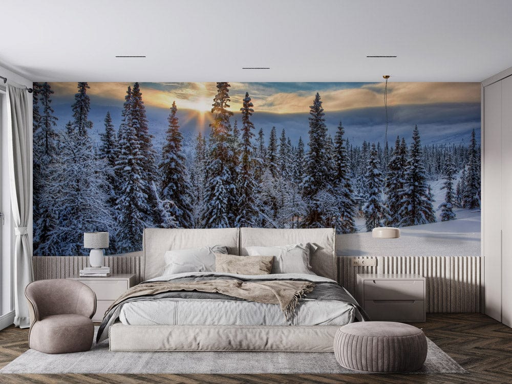 Winter Forest Landscape Mural Wallpaper behind beige bed, grey chairs, and wooden flooring in bedroom.