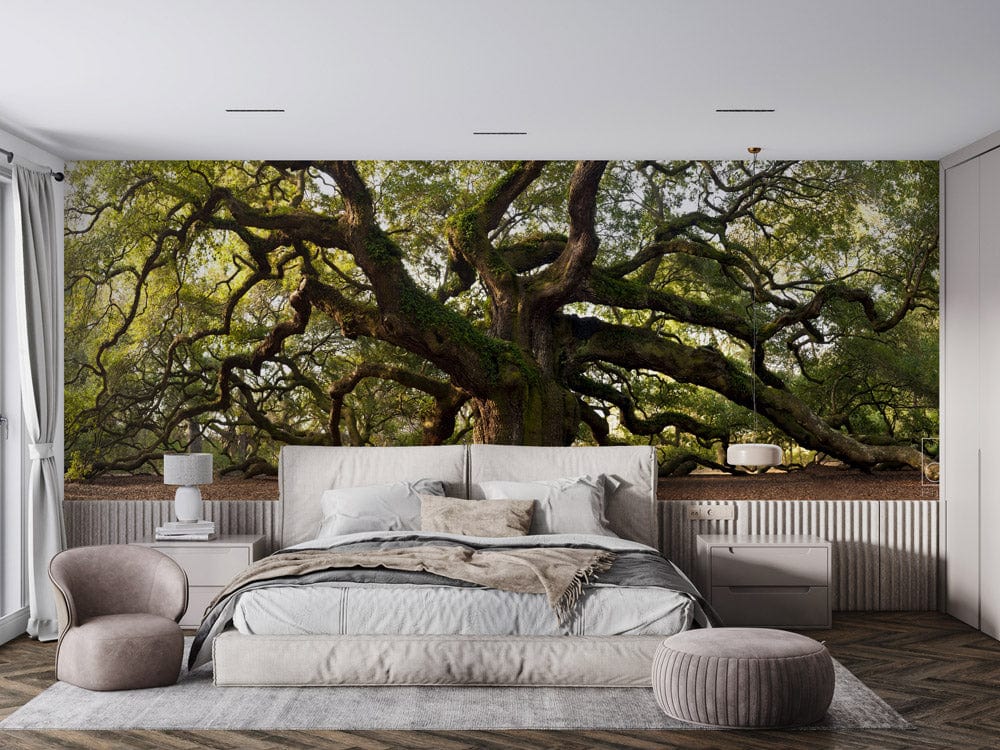 Majestic Ancient Oak Tree Mural in modern bedroom with grey bed, armchair, wooden flooring.