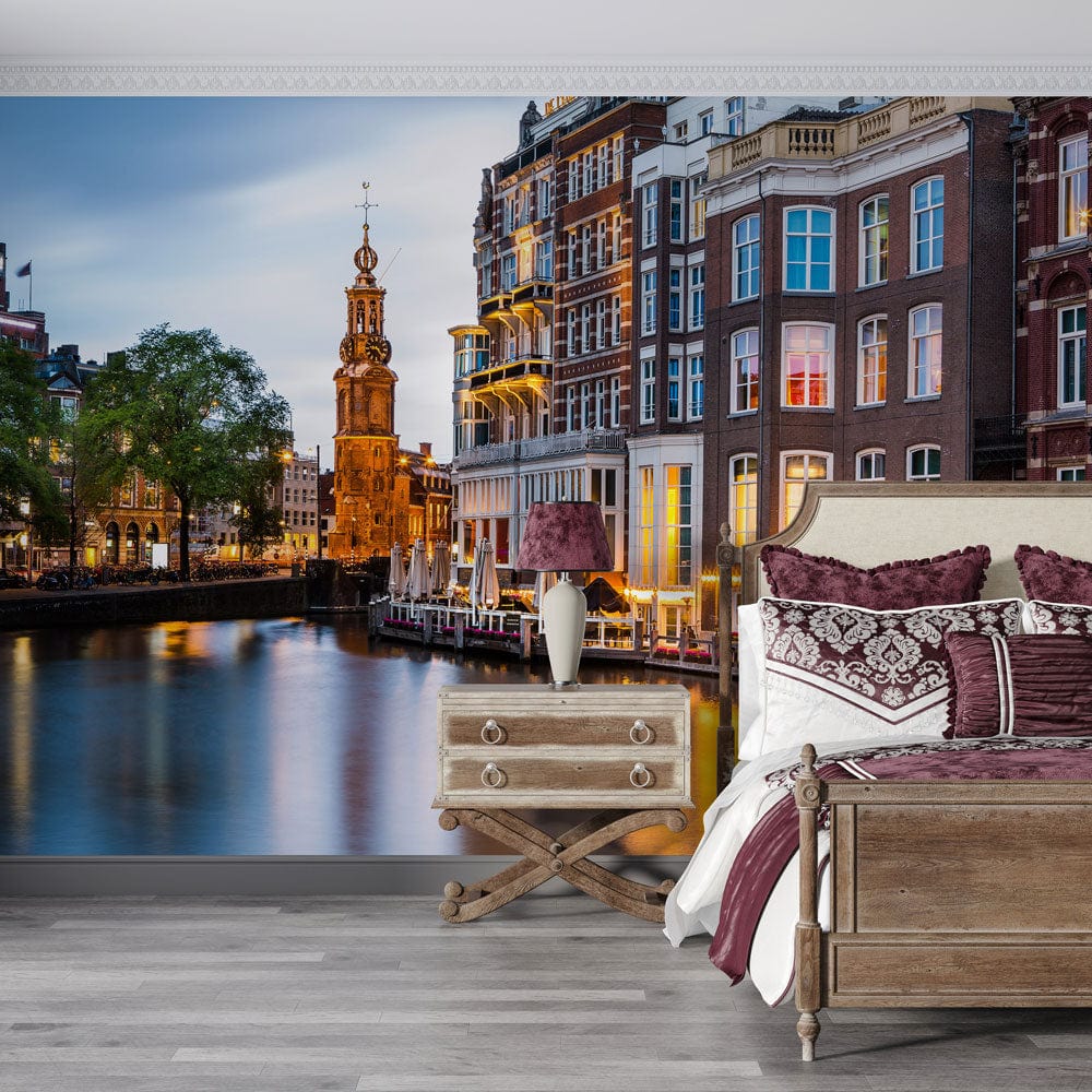Amsterdam Canal Sunset Mural Wallpaper in bedroom with wooden bed, vintage side table, grey flooring.