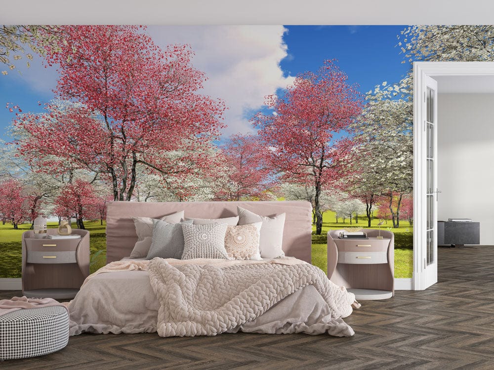 Springtime Blossom Mural Wallpaper with Pink and White Trees; bedroom setting; chevron-patterned flooring; cosy bed.