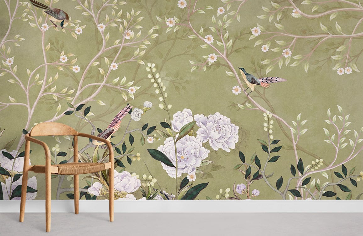 Elegant green Chinoiserie mural wallpaper with birds, blossoms, wooden chair, grey flooring, botanical design.