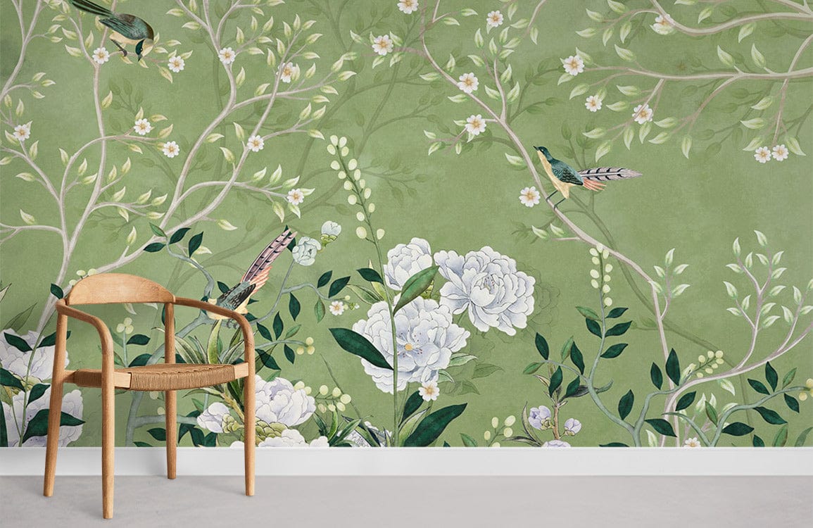 Elegant green floral and bird wallpaper in living room, with wooden chair and light grey flooring.