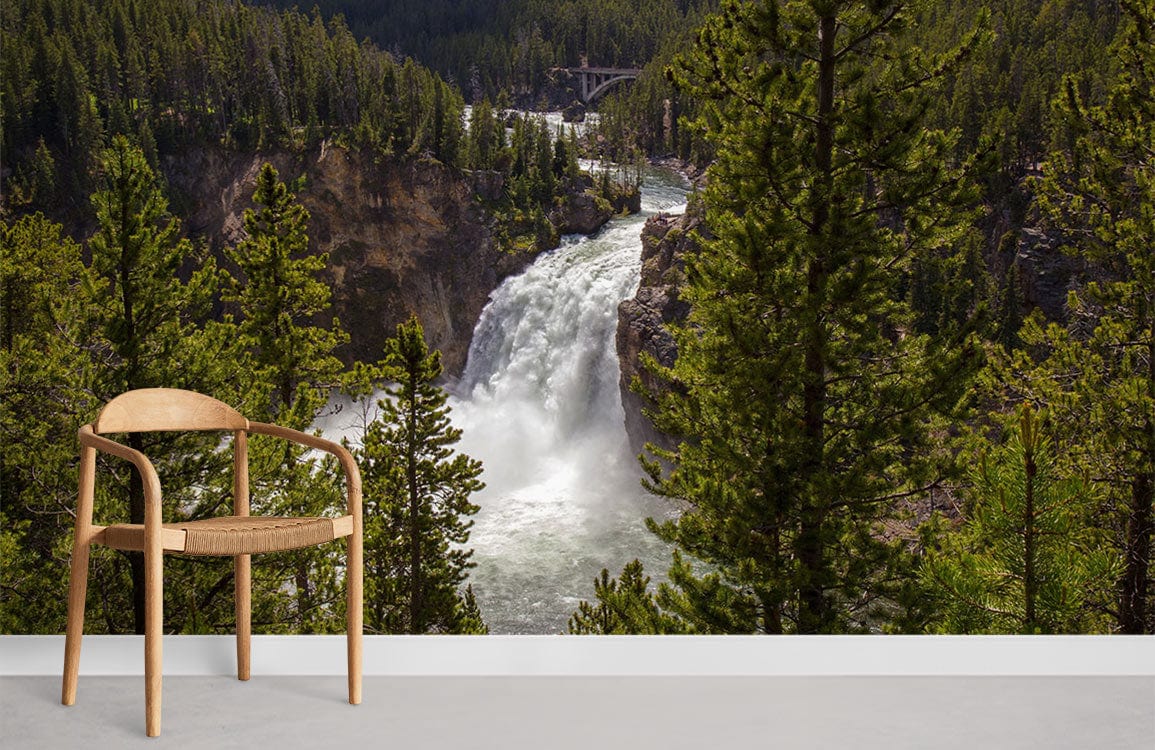 Majestic waterfall mural with lush landscape; modern wooden chair, light floor; nature-inspired room design.
