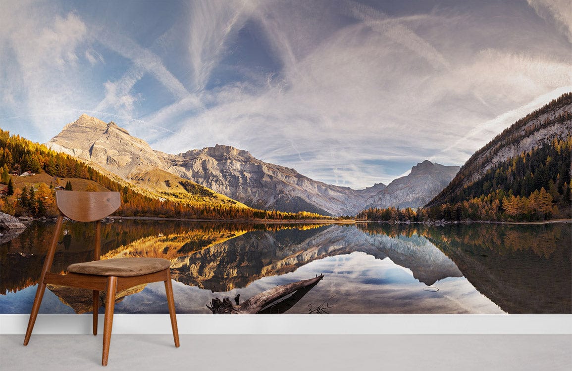 Panoramic mountain lake mural wallpaper with autumn reflection, wooden chair, grey wall, modern design.