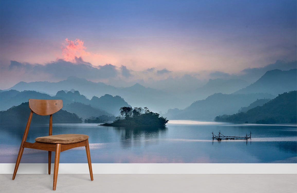 Mountain lake mural wallpaper with wooden chair on grey flooring; serene Décor for tranquil spaces.