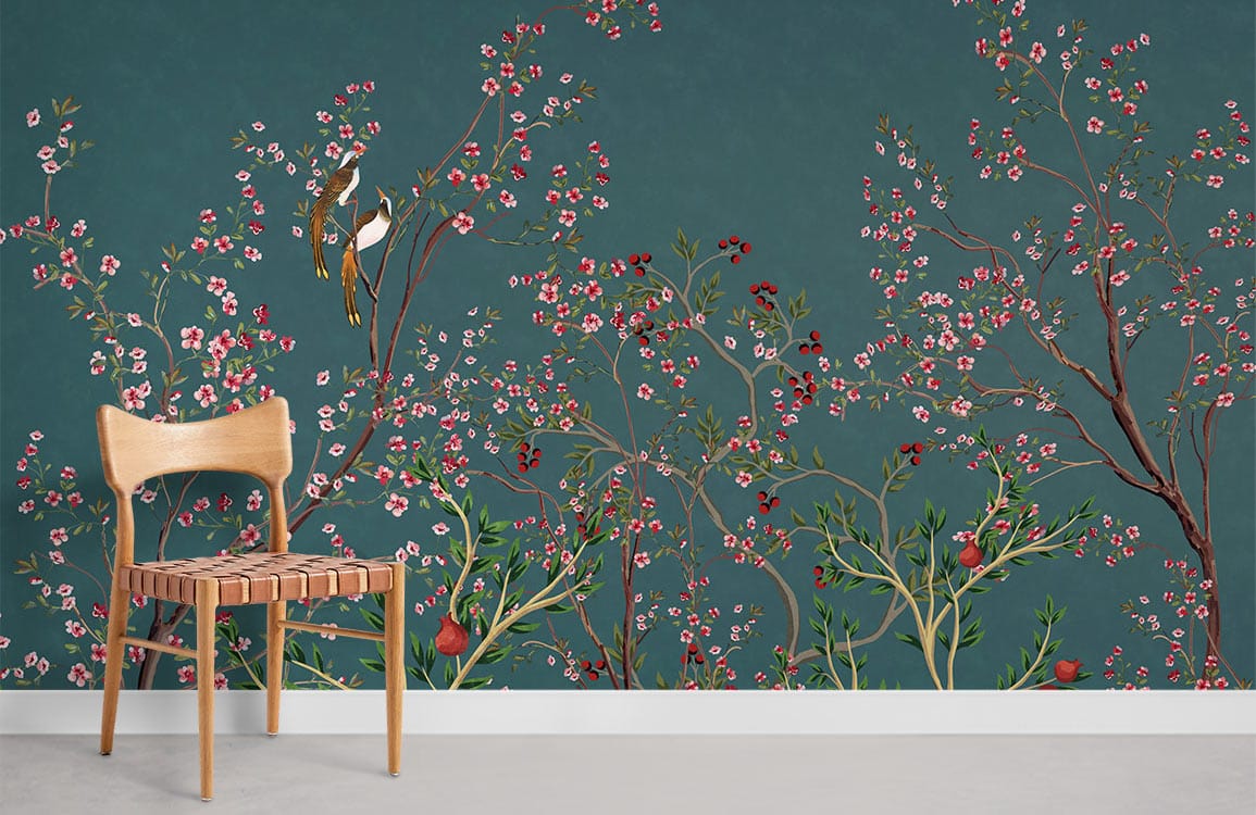 Elegant teal bird and floral Chinoiserie mural wallpaper with wooden chair and grey flooring.