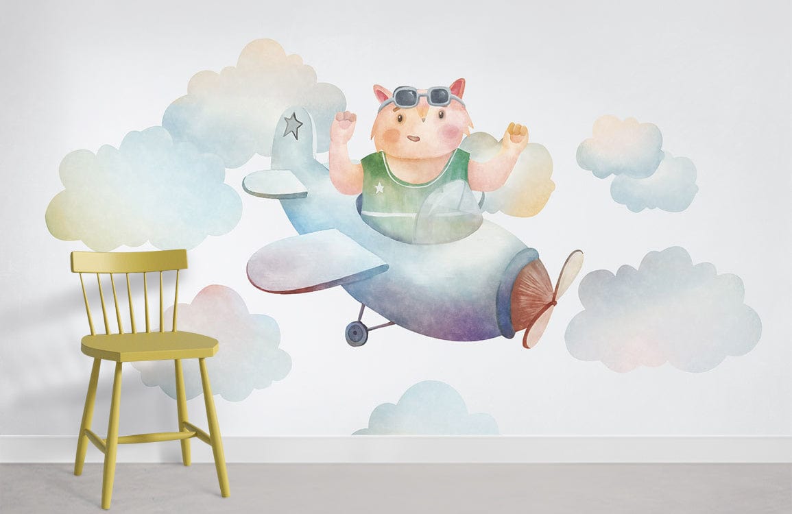 Whimsical Aviator Bear Mural Wallpaper in pastel clouds design; features yellow chair, grey flooring.