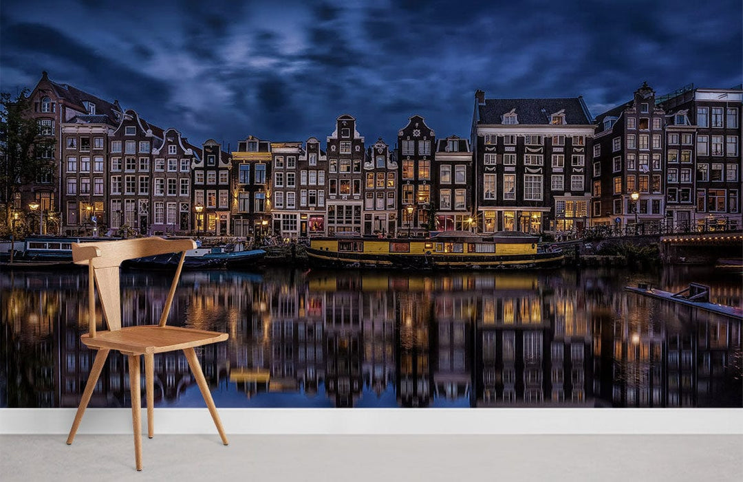 Enchanting Amsterdam canal nightscape mural, deep blue reflections, modern chair, light wood flooring.