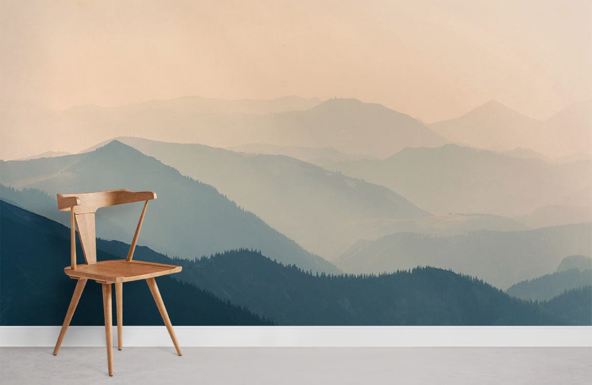 Serene Misty Mountain Range Mural Wallpaper in soft earthy tones, wooden chair, minimalist room design.