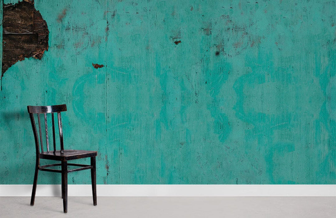 Rustic turquoise vintage wallpaper with industrial charm, black chair, minimalist decor, concrete flooring.