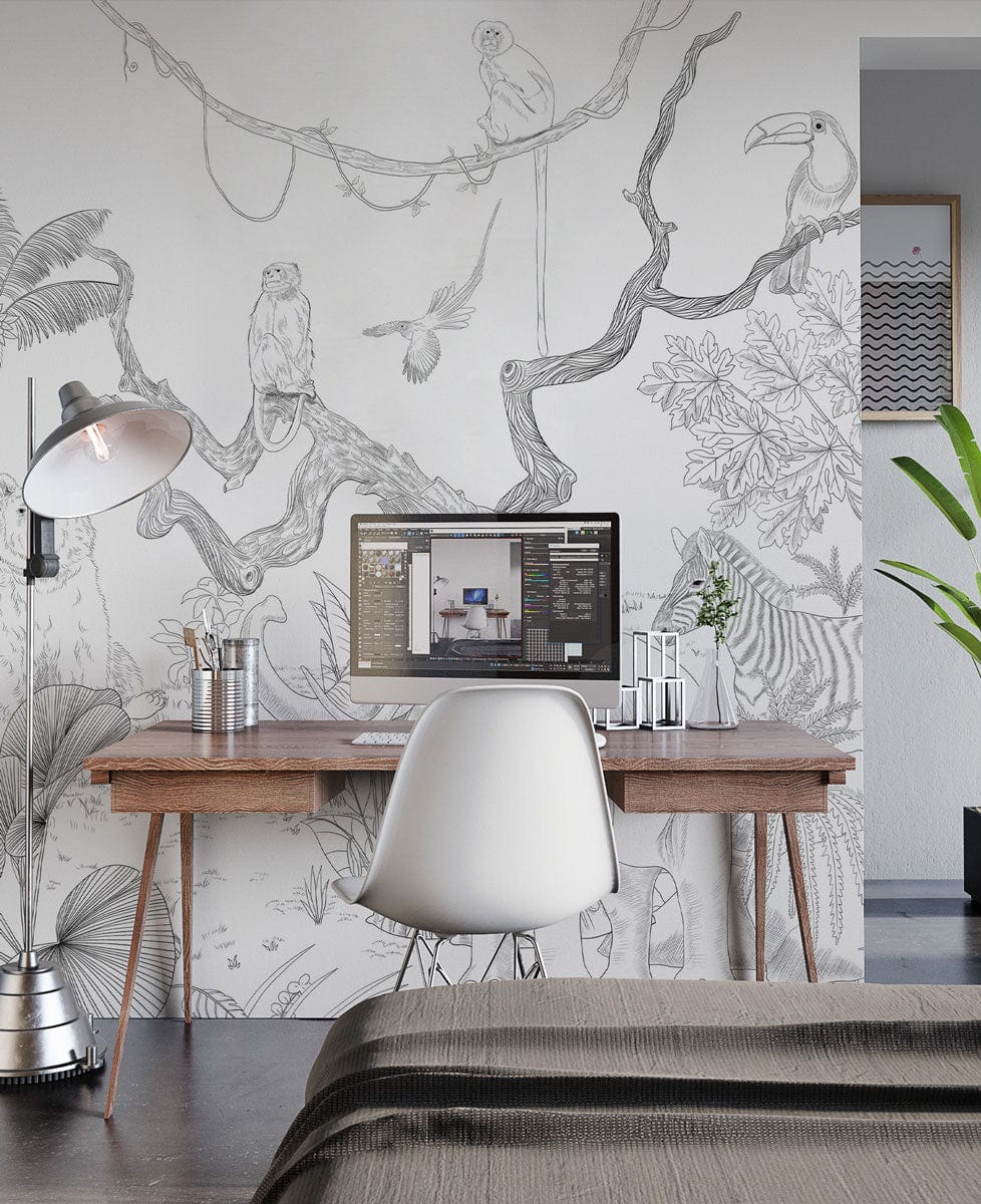 Monochrome safari wildlife mural wallpaper, elegant jungle design in home office with wooden desk, lamp, chair.