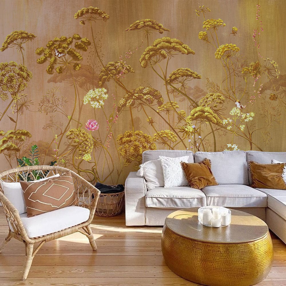 Golden Botanical Meadow mural wallpaper, vintage floral design, wicker chair, beige sofa, wooden flooring, lounge.