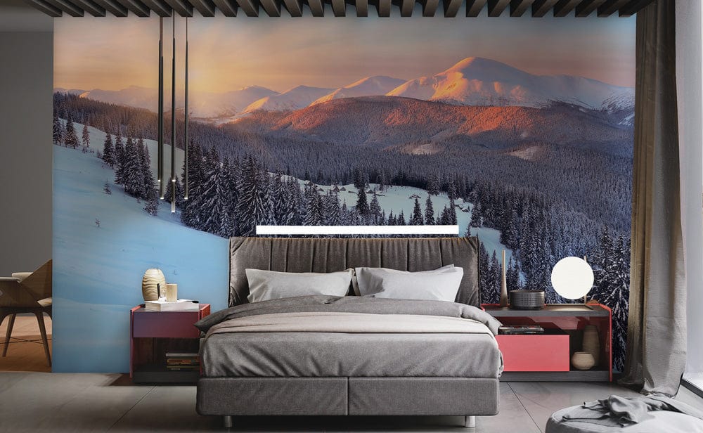 Tranquil Snowy Mountain Sunrise mural in modern bedroom, with grey bed, red side tables, and pendant lights.