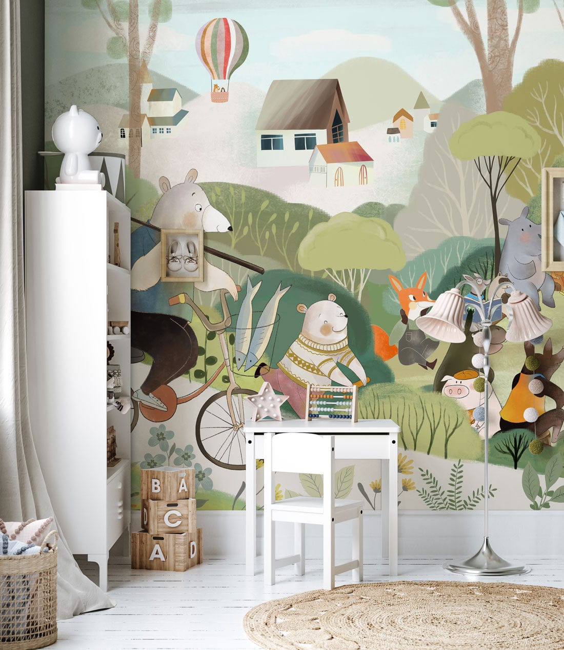 Children's room decorated with Whimsical Forest Friends mural, white wooden flooring, and charming play table.