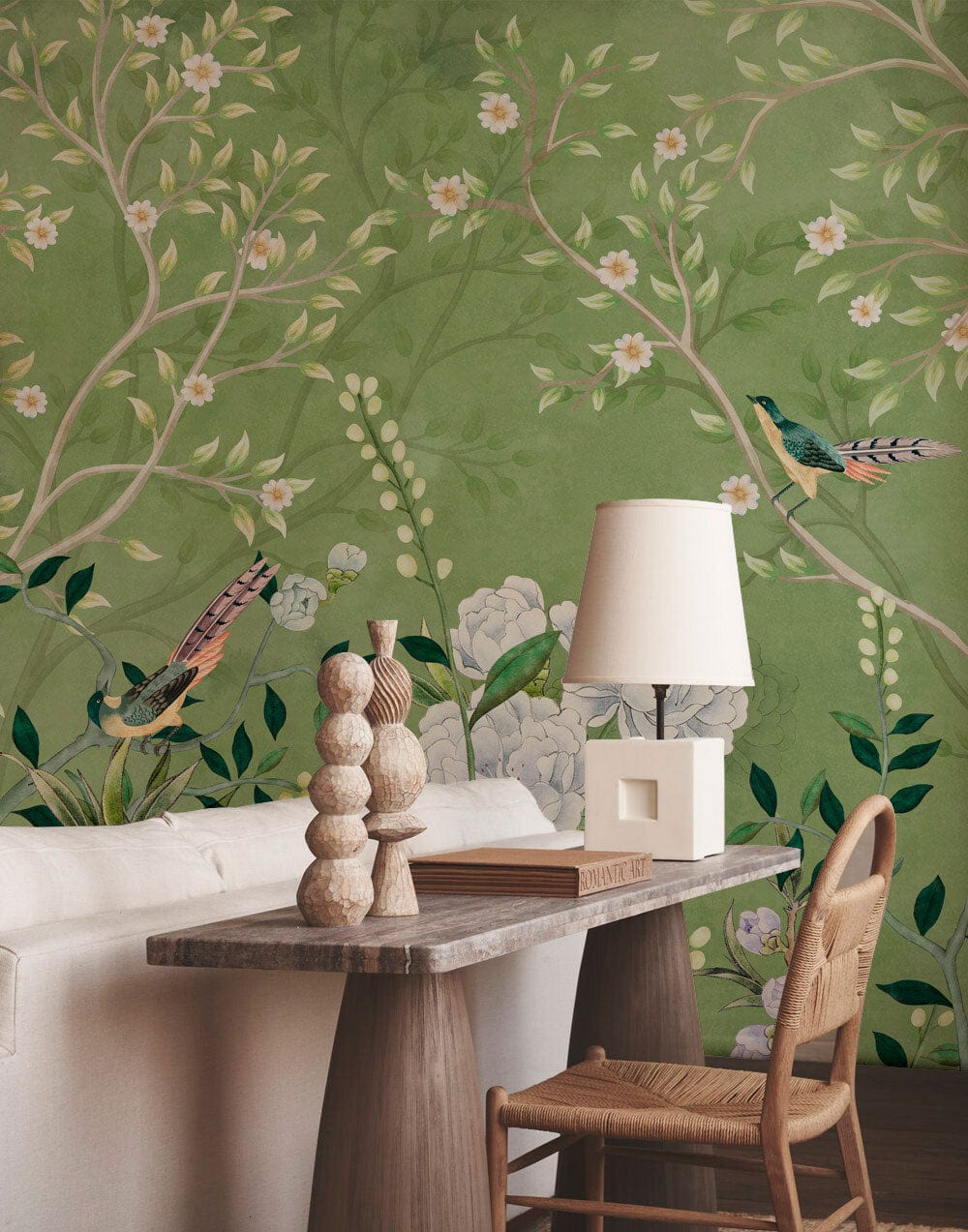 Elegant green floral bird mural wallpaper, white sofa, natural wooden table, and chair in living room.