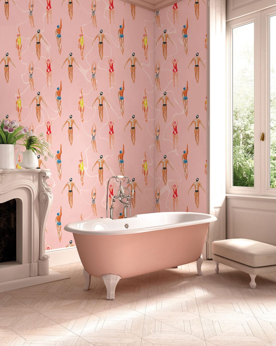 Retro surfer wallpaper in pastel pink bathroom with freestanding tub, patterned flooring, and elegant decor.
