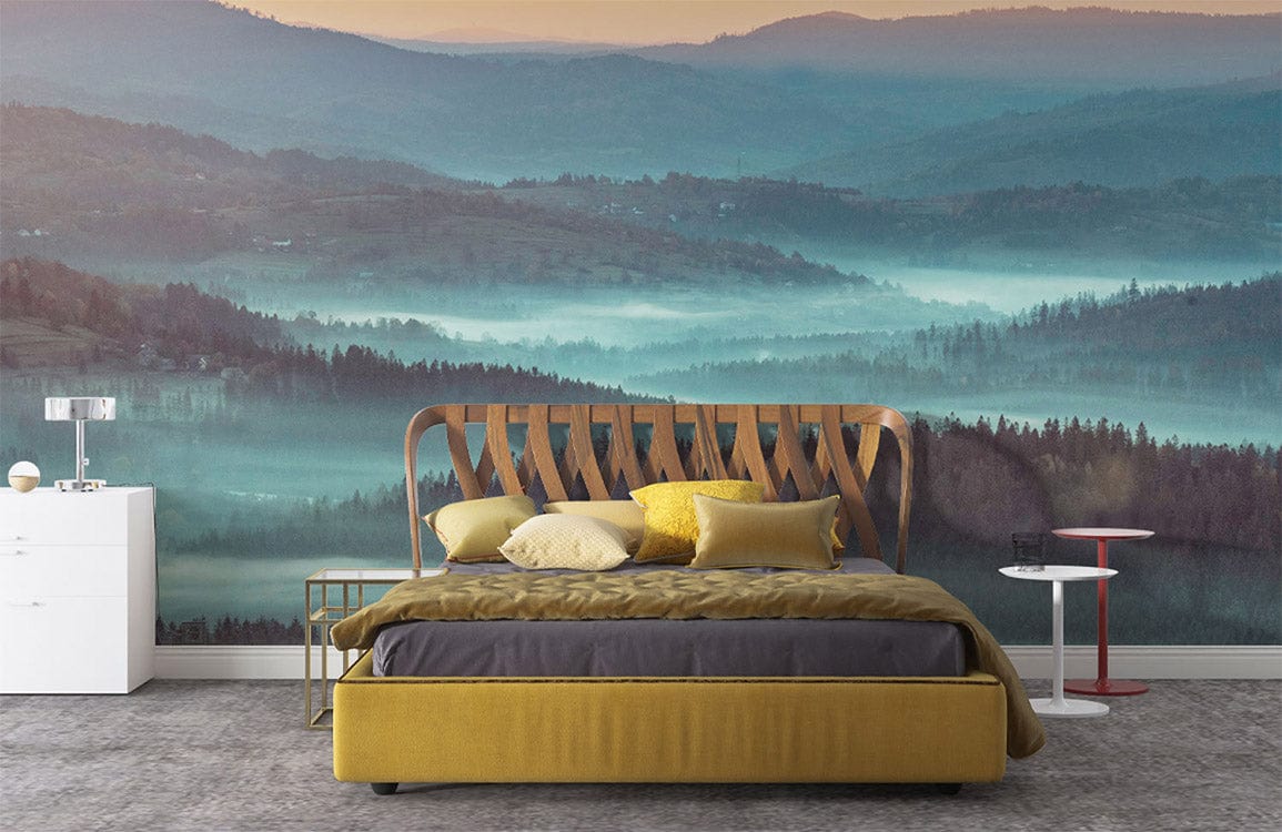 Tranquil Misty Hills mural wallpaper in blue tones, cosy bedroom with modern mustard bed, grey flooring.