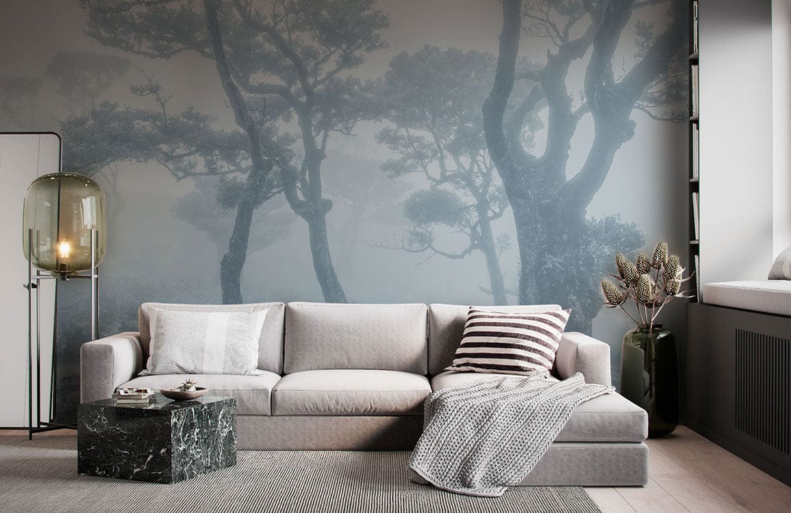 Misty forest wallpaper in grey hues, modern sofa, marble coffee table, sleek lamp, contemporary living room.