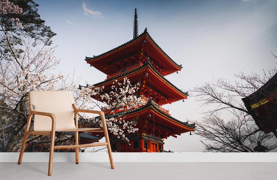 Japanese pagoda mural wallpaper, cherry blossom scene, wooden chair, minimalist design, serene atmosphere.
