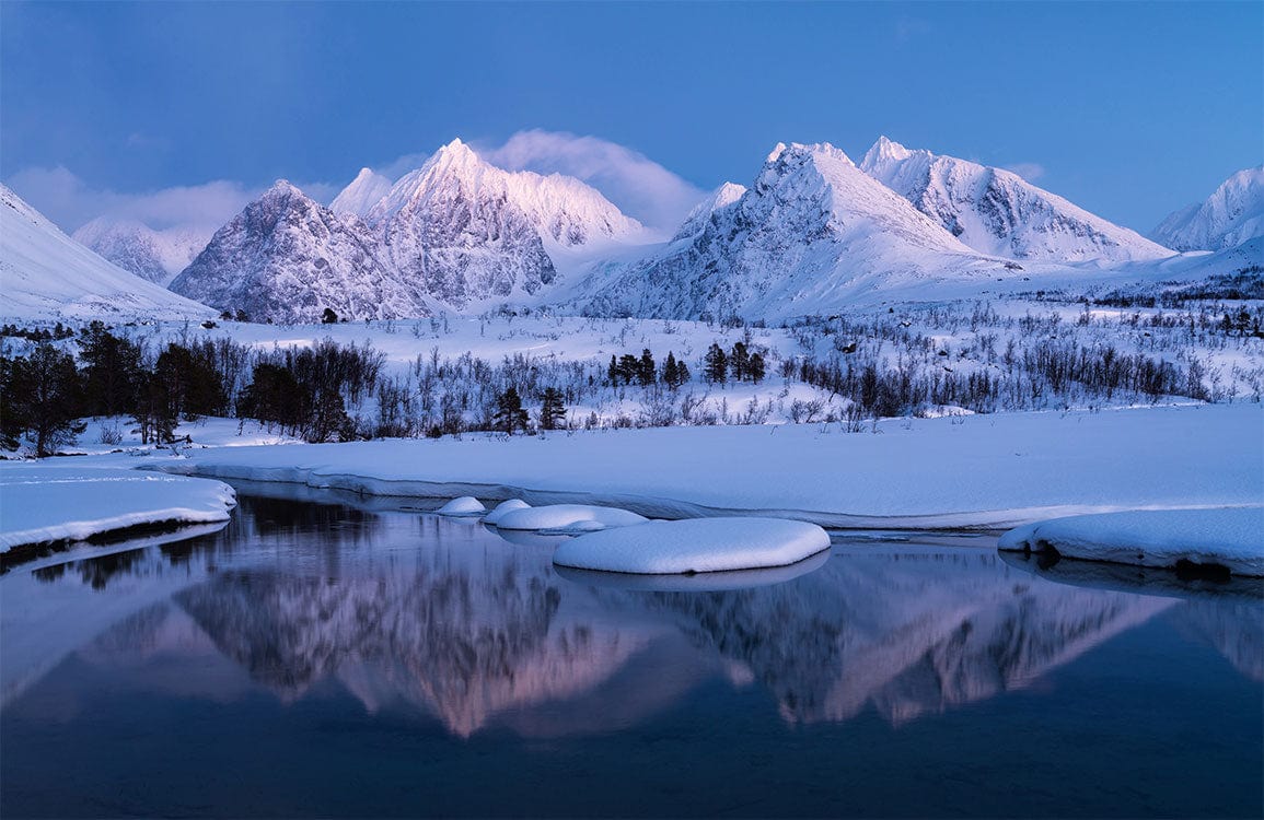 Serene Snowy Mountain Landscape Mural Wallpaper in Cool Blue Tones