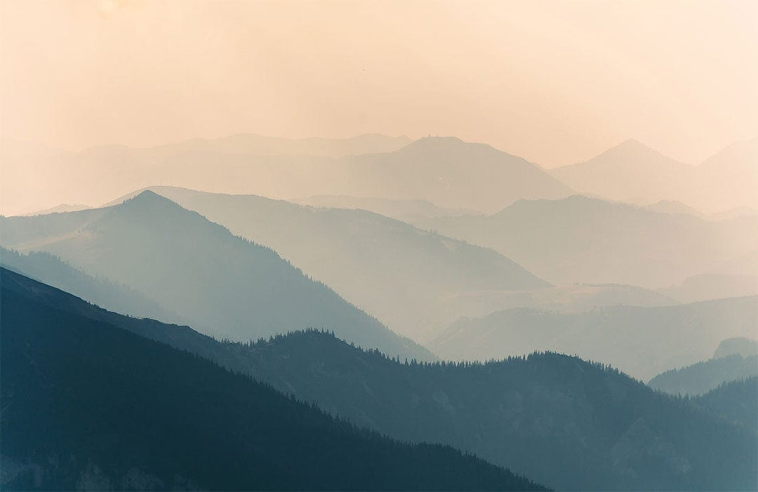 Serene Misty Mountain Range Mural Wallpaper in Soft Earthy Tones