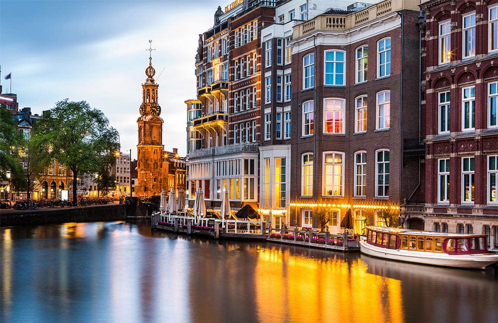 Amsterdam Canal Sunset Mural Wallpaper: Elegant Evening Cityscape in Warm Hues