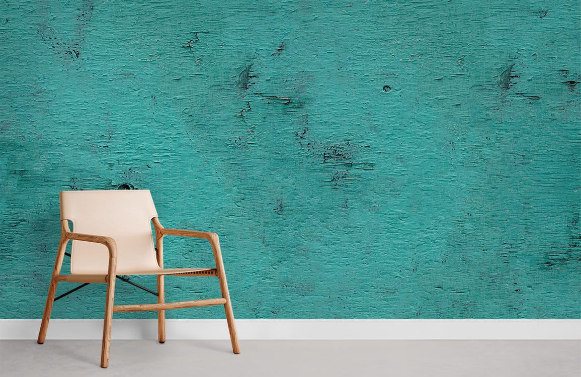Vintage teal distressed wood-effect wallpaper; rustic decor charm with beige modern chair, concrete flooring.