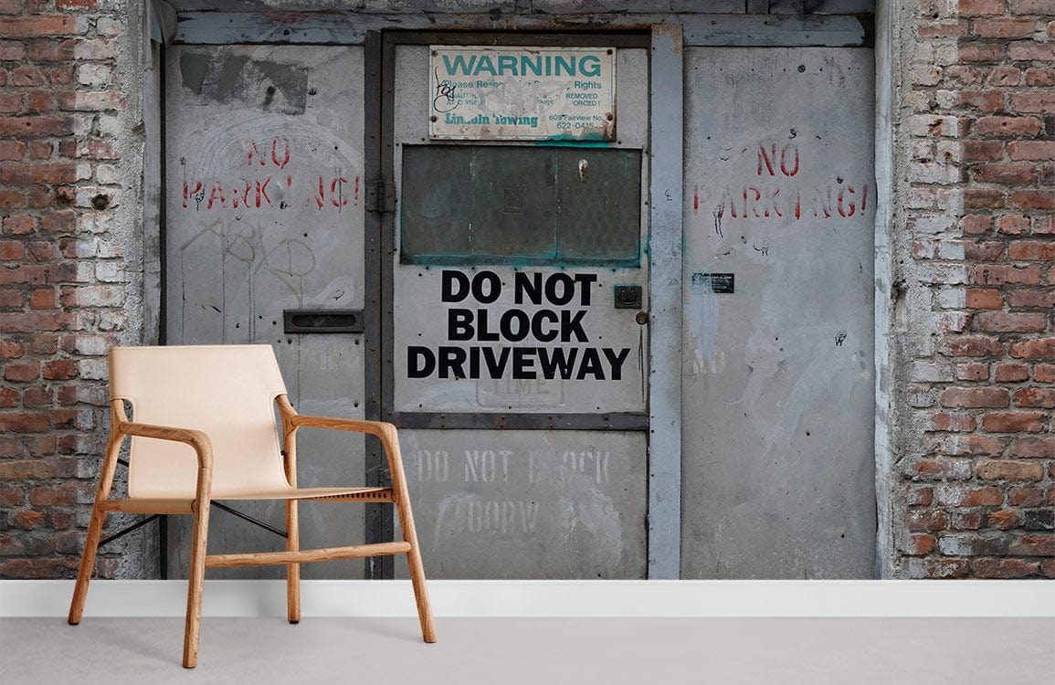 Urban Industrial mural wallpaper, grey tones, brick and steel design, light wood chair, modern decor.