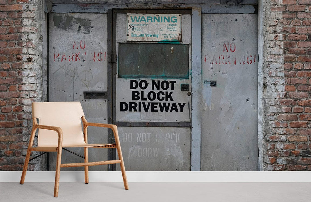 Urban Industrial mural wallpaper, grey tones, brick and steel design, light wood chair, modern decor.