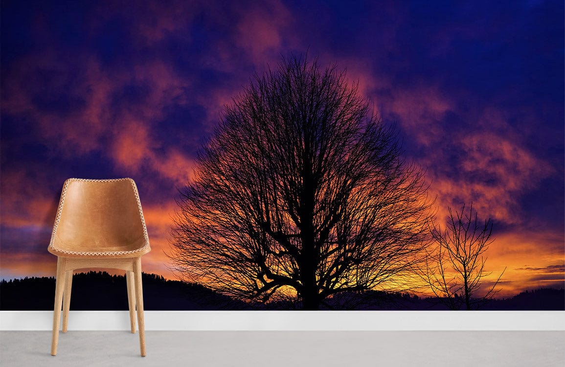 Vivid Twilight Silhouette Wallpaper with purple and orange sunset, modern chair, grey flooring.
