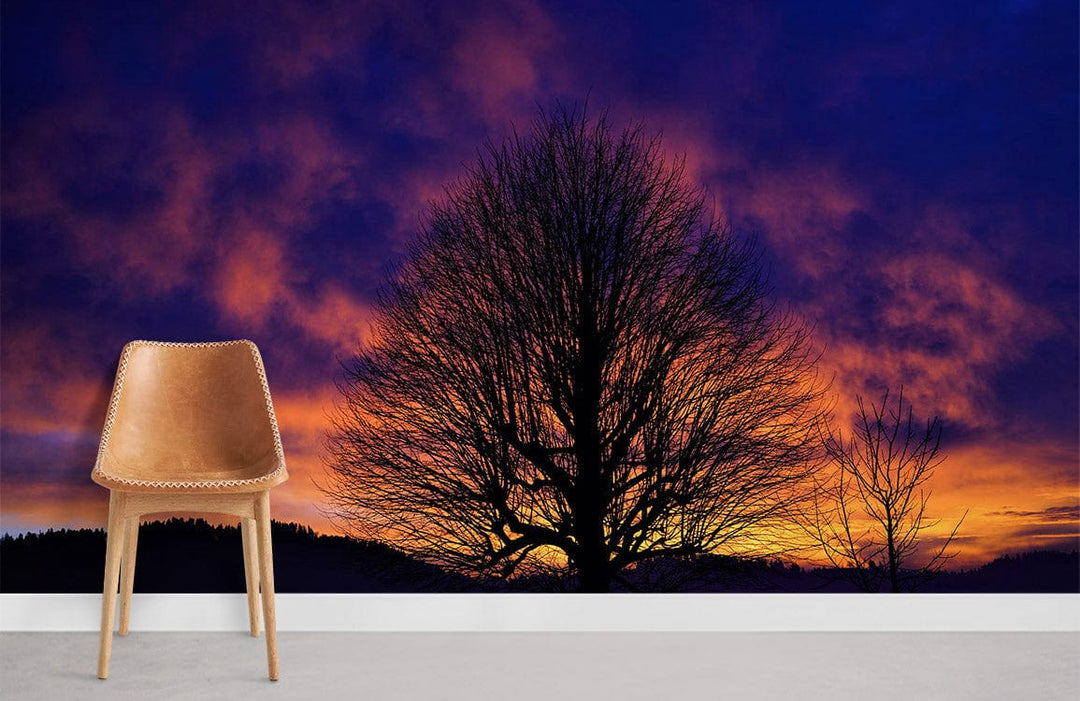 Vivid Twilight Silhouette Wallpaper with purple and orange sunset, modern chair, grey flooring.