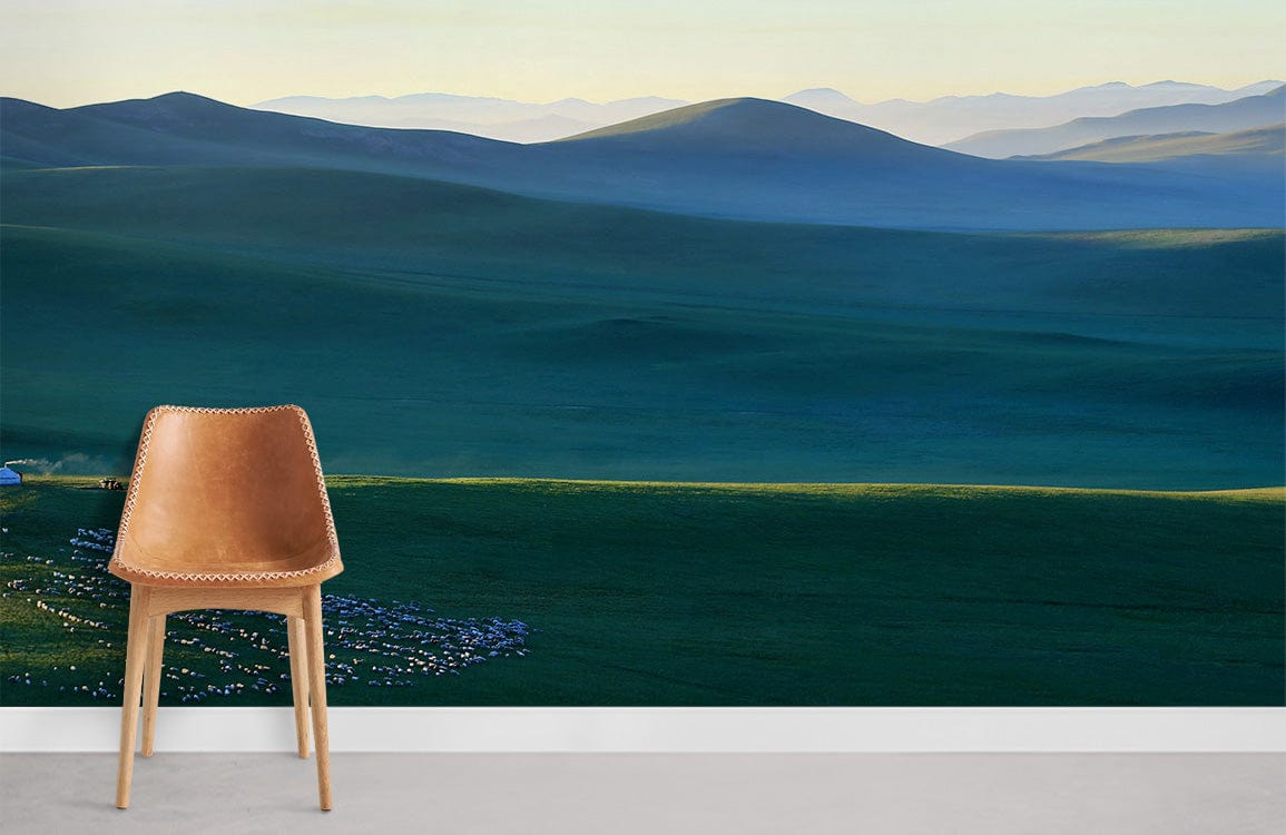 Brown chair, Serene Green Landscape Mural Wallpaper featuring mountains and grazing flock, grey flooring.