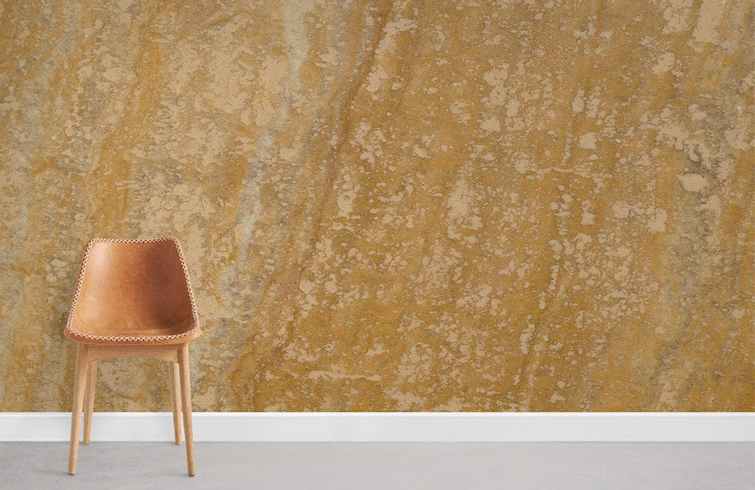 Golden Earth Textured Wallpaper - Rustic Yellow Stone Design with Wooden Chair on Grey Floor.