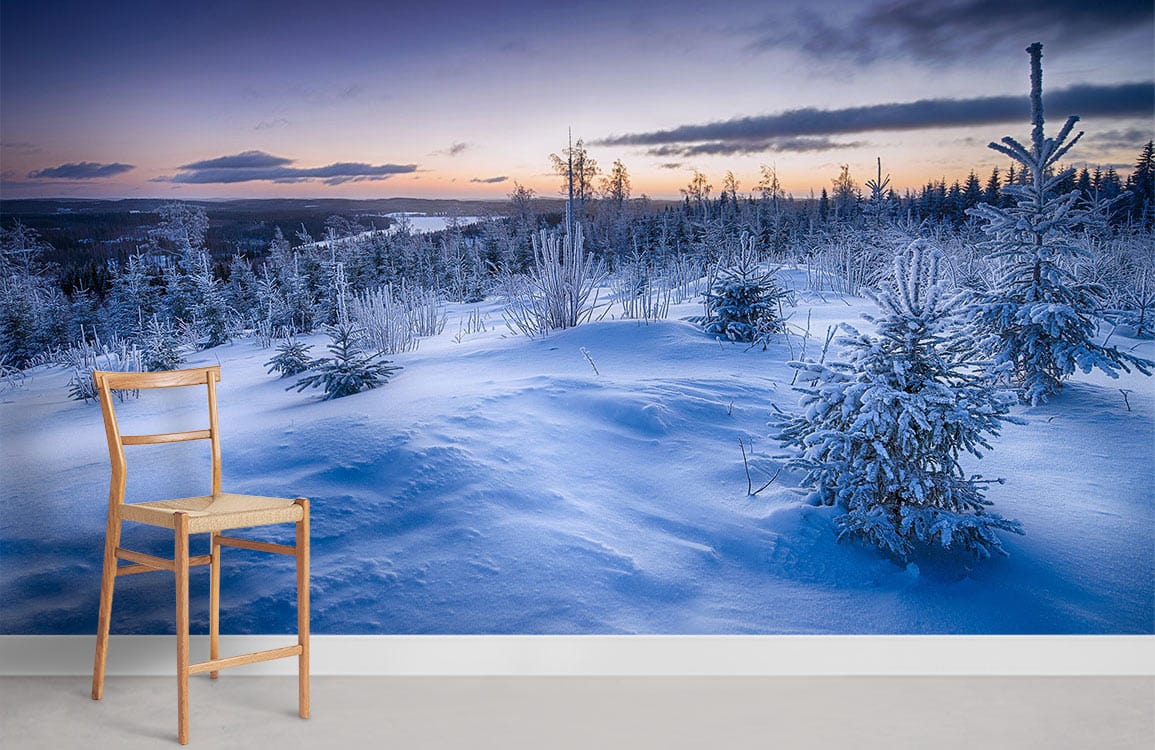 Majestic Winter Wonderland mural wallpaper, icy blue, chair, modern room, grey flooring, serene landscape.