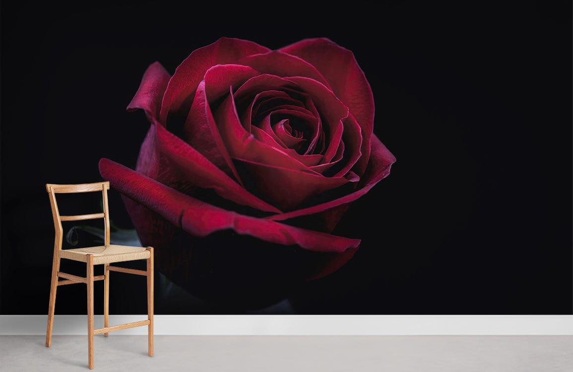 Elegant red rose wallpaper mural on black wall, featuring wooden chair and light grey flooring.