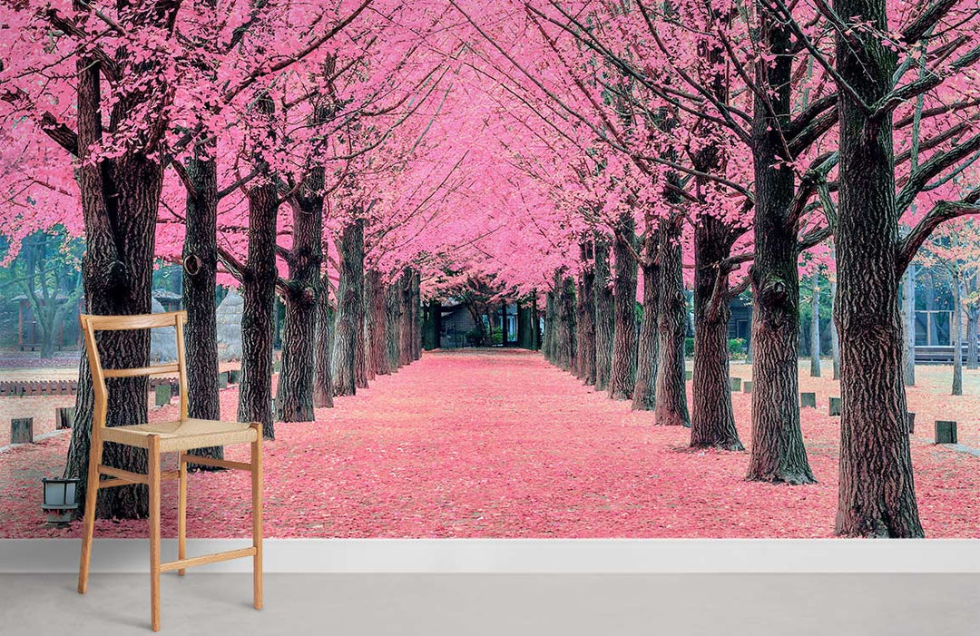 Blossom Avenue Mural Wallpaper, pink cherry trees, wooden chair, neutral flooring, serene wall art.