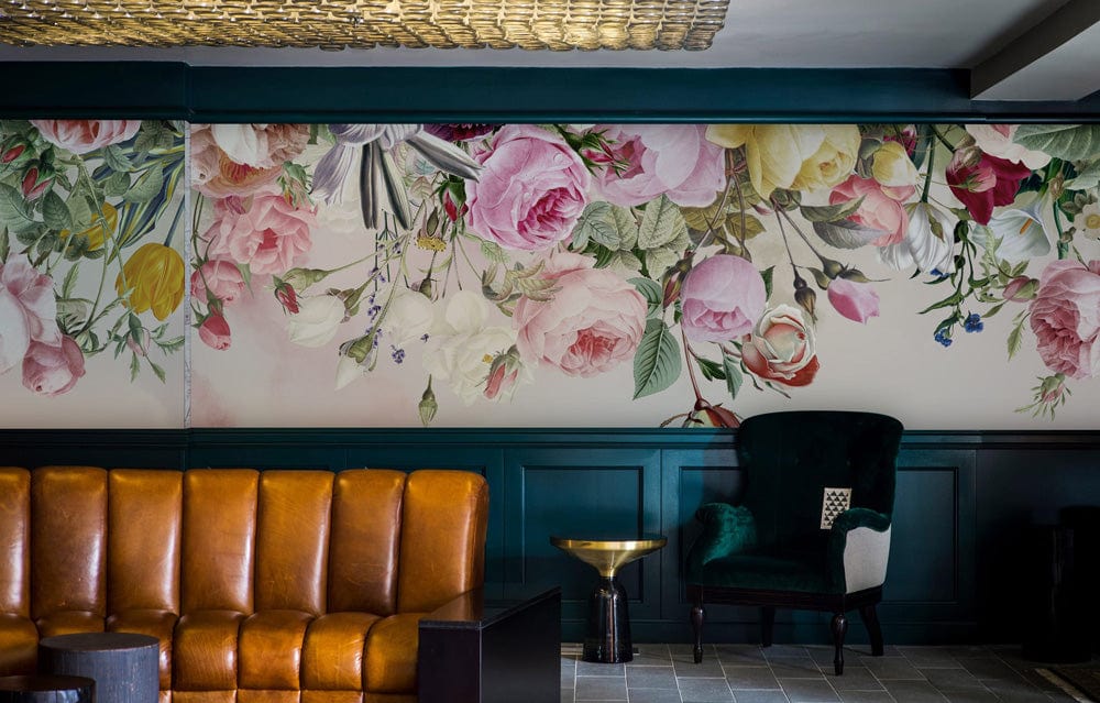 Vintage Floral Blossom Mural Wallpaper, teal wainscoting, brown leather sofa, green velvet chair, elegant lounge.