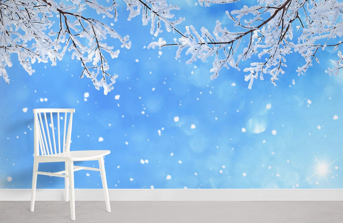 Winter Wonderland Snowy Branches wallpaper with blue sky, white chair, grey flooring in living room.