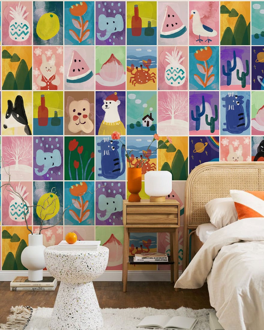 Colourful Animal Patchwork wallpaper in vibrant kids' room with rattan bed, cushioned chair, and wooden flooring.
